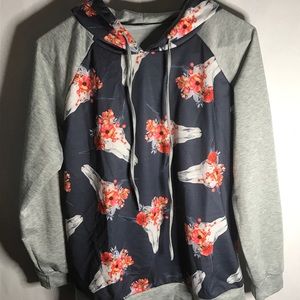 Skulls and flowers patterned hoodie.